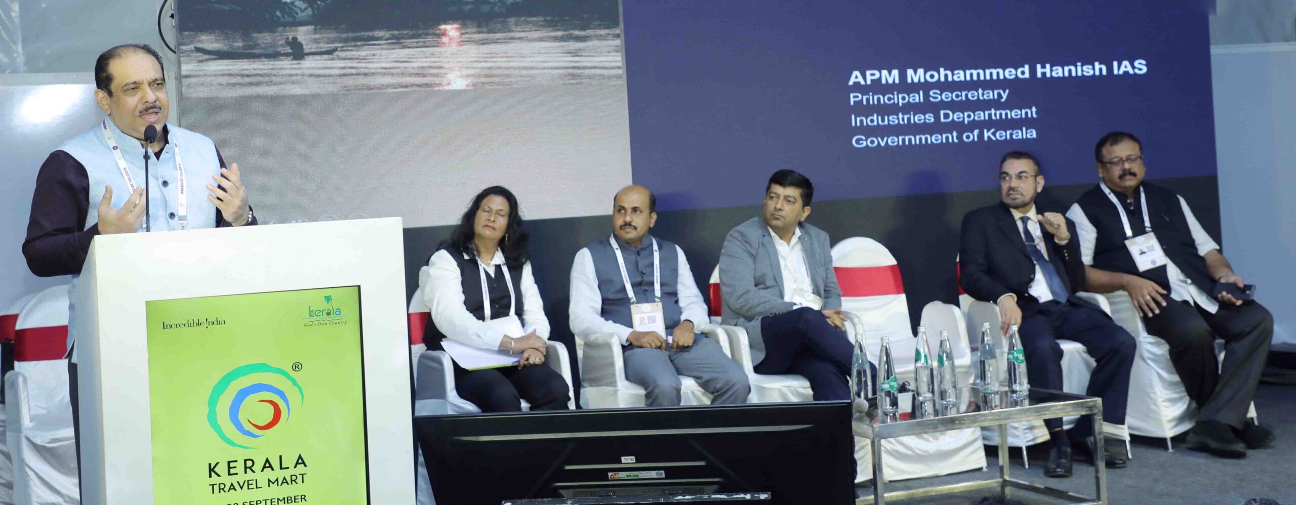 Department of Industries Principal Secretary A P M Mohammed Hanish addresses a seminar on 'Application of AI in Tourism Industry' at Kerala Travel Mart 2024 in Kochi on September 28, Saturday. Others seen are KTM Seminar Committee Vice-Chairperson Nirmala Lilly, moderator Anish Kumar P.K of Travel Planners, IBM Gen AI Consulting Partner Shamidra Basu, KTM Seminar Committee Chairman Riaz Ahmed and KTM Society President Jose Pradeep.