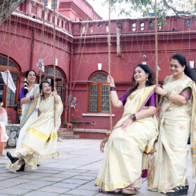 A beautiful sight of people celebrating Onam by singing and swinging
